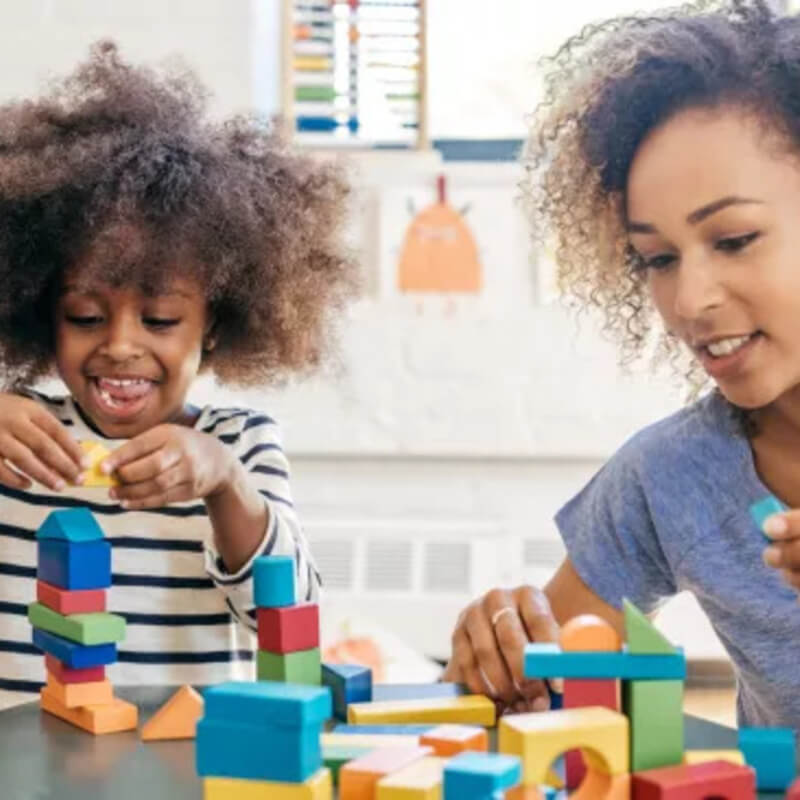 woman playing games with son