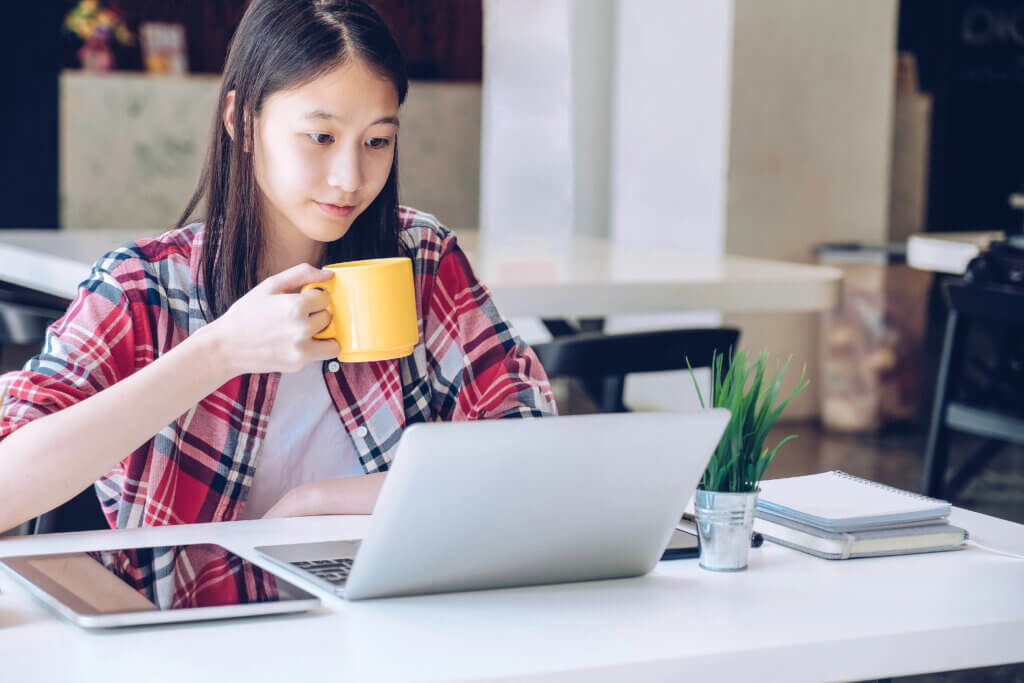 Young high school intern with laptop