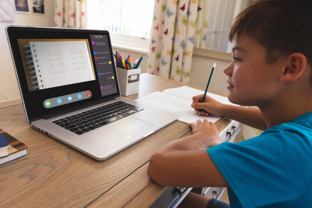 Boy working on a laptop.