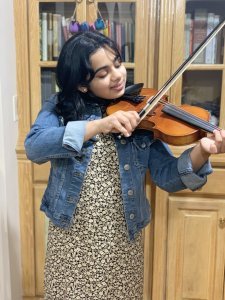 Riya playing violin
