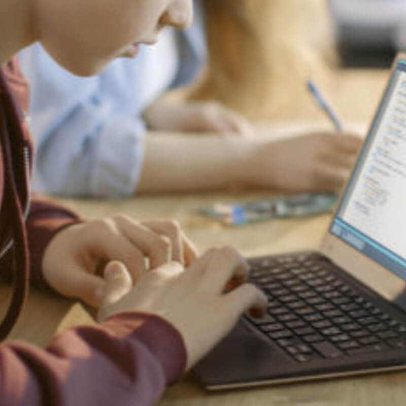 Student typing during lockdown